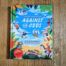 Books by Alastair Humphreys - Against the Odds: The Incredible Struggles of 20 Great Adventurers - Cover on Wooden Floor