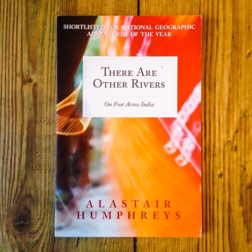 Books by Alastair Humphreys - There Are Other Rivers: On Foot Across India - Cover on Wooden Floor
