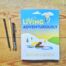 Books by Alastair Humphreys - A Notebook for Living Adventurously: Questions and Answers - Cover on Wooden Floor
