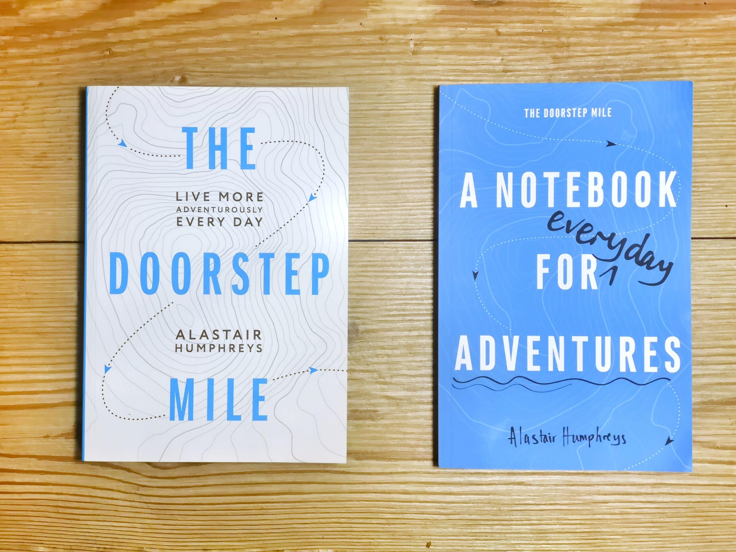 Books by Alastair Humphreys - The Doorstep Mile Bundle - Cover on Wooden Floor