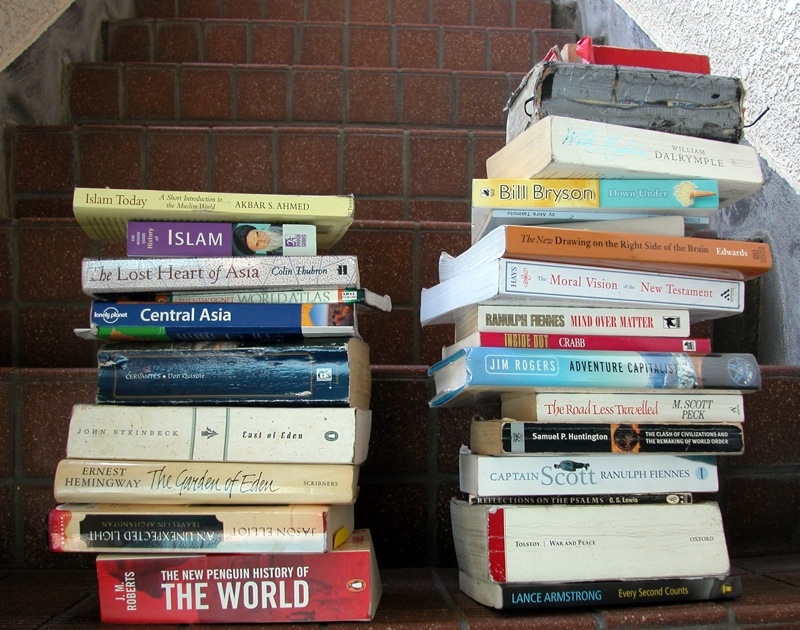Rob and my pile of reading books as we cycled through Japan