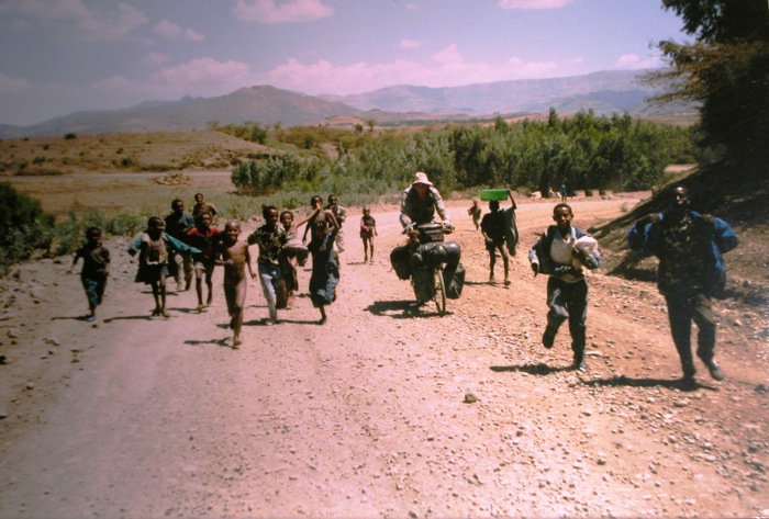 Chased by kids, Ethiopia, Africa