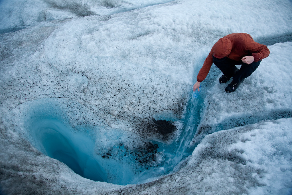 Refilling my water bottle from meltwater streams