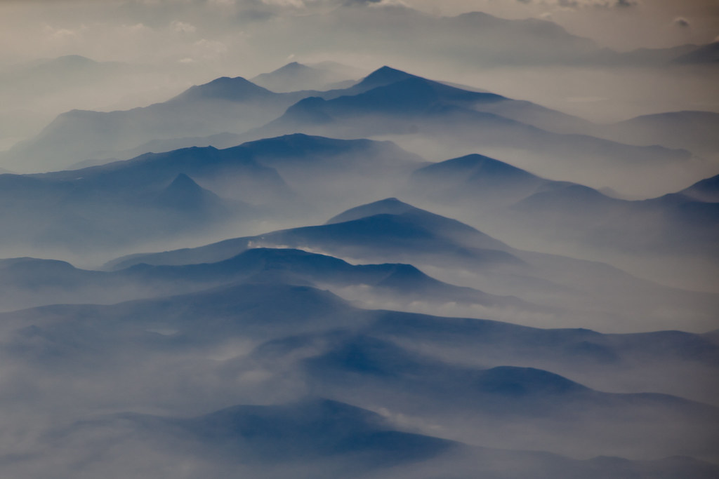 Welsh Mountains through the clouds. Amazing afternoon light on them.